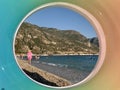 Swimming in the sea with a view through an inflatable ring. Seashore with children on vacation. Summer sea coast against the