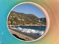 Swimming in the sea with a view through an inflatable ring. Seashore with children on vacation. Summer sea coast against the