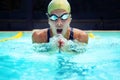 Swimming, sport and athlete breathe in pool, competition or cardio training for triathlon race. Fitness, workout and Royalty Free Stock Photo