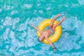 Swimming, summer vacation - child boy playing in blue wat