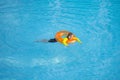 Swimming, summer vacation. Cute child playing in blue water. Kid enjoying summer vacation in water in the swimming pool