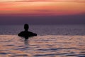 Swimming in sunset sunrise. Man swimming in infinity pool. Copy space banner. Hotel business, travel concept, travelling