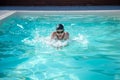 Swimmer in pool head above water hands in front Royalty Free Stock Photo