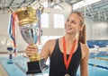 Swimming, trophy and winner of competition with medal, achievement or happiness from success in the race or pool Royalty Free Stock Photo