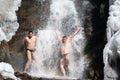 Swimming in winter waterfall Royalty Free Stock Photo