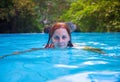 Swimming woman in open swimming pool. Girl in open swimming pool.