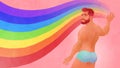 Man in swimsuit taking part in PRIDE events. Gorgeous red hair male painting rainbow to represent LGBT rights and movements.