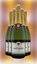 Five Bottles of Taittinger Brut Champagne on an abstract  background Royalty Free Stock Photo