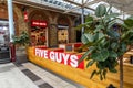 Swindon, UK - October 27, 2023: FIVE GUYS, famous franchise of fast food restaurants, burgers, fries, milkshakes in