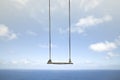 Swing without anyone flies free in the sky Royalty Free Stock Photo