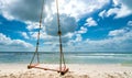 Swing attached to a palm tree in the idyllic Sao beach in Phu Quoc island