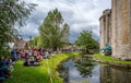 Swing band performing in front of Nunney Castle and moat in Nunney, Somerset, UK