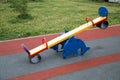 Swing bright color in the form of a Dolphin on the Playground with rubberized surface.
