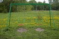 Swing for children, empty, against a background