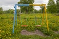 Swing for children, empty, against a background
