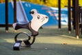 Swing for children on a kids playground, swing mouse toy for kids on a childrens playground Royalty Free Stock Photo