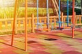 Swing for children in the public playground, sunlight effect Royalty Free Stock Photo