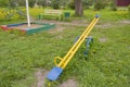 Swing for children, yellow with blue seats