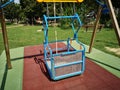 Swing for the disabled inserted in the amusement park