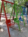 swing in the garden, empty swings in the playground, colorful swings in the city park Salatiga, central java Royalty Free Stock Photo