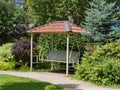Swing gazebo in the garden park. Landscaping Royalty Free Stock Photo