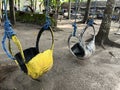 A swing hanging on the tree in the park for leisure activities. Royalty Free Stock Photo