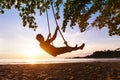 Swing on paradise tropical beach at sunset Royalty Free Stock Photo