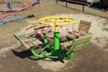 Swing on the playground fenced with a red-white forbidding tape