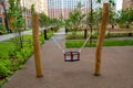 Swing with racks made of natural logs on the playground in the courtyard of a residential building. Kids sports Royalty Free Stock Photo