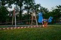 Swing in restricted area playground in Italy