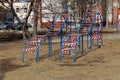 Swing on the playground fenced with a red-white forbidding tape