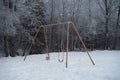 Swing set in the winter Royalty Free Stock Photo