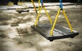 Swing with shadow chain in the playground