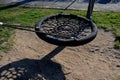 Swing trains stability at the children`s rope center, playground for schoolchildren. A very torn net must be repaired or replaced. Royalty Free Stock Photo