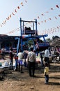 swing in the village in a fare with crowd.