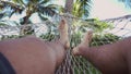 Swinging in a hammock, feets.