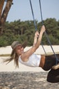 Swinging lady in nature Royalty Free Stock Photo