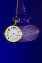 Swinging Pocket Watch Beckoning You to Look More Closely