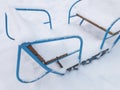 Swings covered with snow