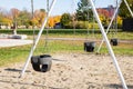 Swings at playground in park in autumn without people Royalty Free Stock Photo
