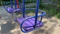 Swings in Playground, Purple blue swings, Happy child concept