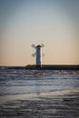 Swinoujscie, West Pomeranian - Poland - June 14, 2021: View on windmill Stawa MÃâyny at sunrise. Navigational mark