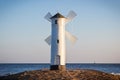 Swinoujscie, West Pomeranian - Poland - June 14, 2021: View on windmill Stawa MÃâyny at sunrise. Navigational mark