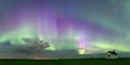 Swirl of Aurora Borealis Northern Lights over the historical North Saskatchewan Landing school