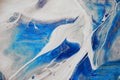 Swirl of blue dye dissolved in light gray and golden pigment . acrylic diffusion abstract beautiful background