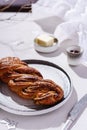 Swirl brioche with poppy seeds served with butter and jam Royalty Free Stock Photo