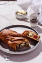 Swirl brioche with poppy seeds served with butter and jam Royalty Free Stock Photo