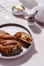 Swirl brioche with poppy seeds served with butter and jam Royalty Free Stock Photo