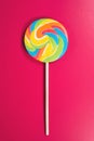 Swirl round lollipop on pink background.