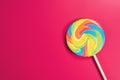 Swirl round lollipop on pink background.